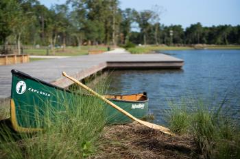 Canoe_in_grass_at_boardwalk.jpg